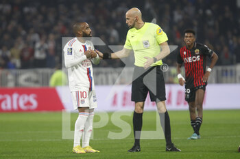 2022-11-11 - Referee Eric WATTELLIER and Alexandre LACAZETTE of Lyon during the French championship Ligue 1 football match between Olympique Lyonnais (Lyon) and OGC Nice on November 11, 2022 at Groupama stadium in Decines-Charpieu near Lyon, France - FOOTBALL - FRENCH CHAMP - LYON V NICE - FRENCH LIGUE 1 - SOCCER
