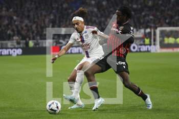 2022-11-11 - Malo GUSTO of Lyon and Jordan LOTOMBA of Nice during the French championship Ligue 1 football match between Olympique Lyonnais (Lyon) and OGC Nice on November 11, 2022 at Groupama stadium in Decines-Charpieu near Lyon, France - FOOTBALL - FRENCH CHAMP - LYON V NICE - FRENCH LIGUE 1 - SOCCER