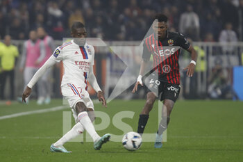 2022-11-11 - Karl TOKO EKAMBI of Lyon and Youcef ATAL of Nice during the French championship Ligue 1 football match between Olympique Lyonnais (Lyon) and OGC Nice on November 11, 2022 at Groupama stadium in Decines-Charpieu near Lyon, France - FOOTBALL - FRENCH CHAMP - LYON V NICE - FRENCH LIGUE 1 - SOCCER