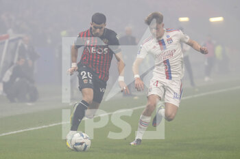 2022-11-11 - Youcef ATAL of Nice and Johann LEPENANT of Lyon during the French championship Ligue 1 football match between Olympique Lyonnais (Lyon) and OGC Nice on November 11, 2022 at Groupama stadium in Decines-Charpieu near Lyon, France - FOOTBALL - FRENCH CHAMP - LYON V NICE - FRENCH LIGUE 1 - SOCCER