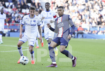 2022-11-13 - Kylian Mbappe of PSG, Mathias Autret of Auxerre (left) during the French championship Ligue 1 football match between Paris Saint-Germain and AJ Auxerre on November 13, 2022 at Parc des Princes stadium in Paris, France - FOOTBALL - FRENCH CHAMP - PARIS SG V AUXERRE - FRENCH LIGUE 1 - SOCCER