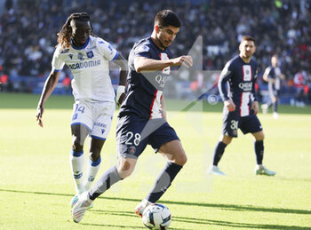 2022-11-13 - Carlos Soler of PSG, Gideon Mensah of Auxerre (left) during the French championship Ligue 1 football match between Paris Saint-Germain and AJ Auxerre on November 13, 2022 at Parc des Princes stadium in Paris, France - FOOTBALL - FRENCH CHAMP - PARIS SG V AUXERRE - FRENCH LIGUE 1 - SOCCER