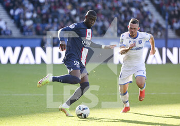 2022-11-13 - Nordi Mukiele of PSG, Gaetan Perrin of Auxerre during the French championship Ligue 1 football match between Paris Saint-Germain and AJ Auxerre on November 13, 2022 at Parc des Princes stadium in Paris, France - FOOTBALL - FRENCH CHAMP - PARIS SG V AUXERRE - FRENCH LIGUE 1 - SOCCER
