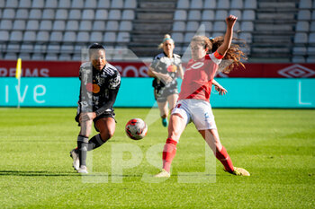 2022-02-27 - Catarina Macario of Olympique Lyonnais and Rachel Corboz of Stade de Reims fight for the ball during the Women's French championship, D1 Arkema football match between Stade de Reims and Olympique Lyonnais (Lyon) on February 27, 2022 at Auguste Delaune stadium in Reims, France - STADE DE REIMS VS OLYMPIQUE LYONNAIS (LYON) - FRENCH WOMEN DIVISION 1 - SOCCER