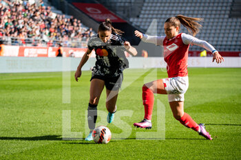 2022-02-27 - Delphine Cascarino of Olympique Lyonnais and Oceane Deslandes of Stade de Reims fight for the ball during the Women's French championship, D1 Arkema football match between Stade de Reims and Olympique Lyonnais (Lyon) on February 27, 2022 at Auguste Delaune stadium in Reims, France - STADE DE REIMS VS OLYMPIQUE LYONNAIS (LYON) - FRENCH WOMEN DIVISION 1 - SOCCER