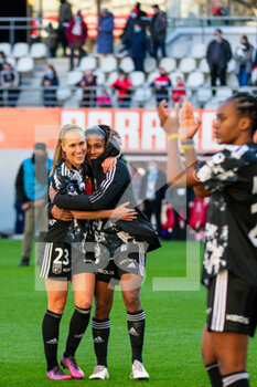 2022-02-27 - Janice Cayman of Olympique Lyonnais and Catarina Macario of Olympique Lyonnais celebrate the victory after the Women's French championship, D1 Arkema football match between Stade de Reims and Olympique Lyonnais (Lyon) on February 27, 2022 at Auguste Delaune stadium in Reims, France - STADE DE REIMS VS OLYMPIQUE LYONNAIS (LYON) - FRENCH WOMEN DIVISION 1 - SOCCER