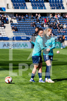 2022-04-03 - Mathilde Bourdieu of Paris FC and Celina Ould Hocine of Paris FC warm up ahead of the Women's French championship, D1 Arkema football match between Paris FC and Paris Saint-Germain on April 3, 2022 at Sebastien Charlety stadium in Paris, France - PARIS FC VS PARIS SAINT-GERMAIN - FRENCH WOMEN DIVISION 1 - SOCCER