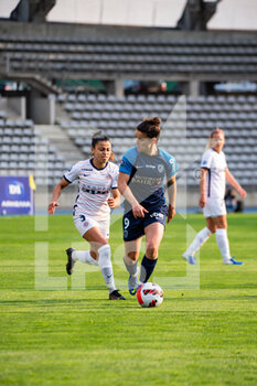 2022-04-15 - Ines Belloumou of Montpellier Herault Sport Club and Mathilde Bourdieu of Paris FC fight for the ball during the Women's French championship D1 Arkema football match between Paris FC and Montpellier HSC on April 15, 2022 at Charlety stadium in Paris, France - PARIS FC VS MONTPELLIER HSC - FRENCH WOMEN DIVISION 1 - SOCCER