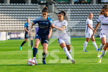 2022-04-15 - Mathilde Bourdieu of Paris FC and Ines Belloumou of Montpellier Herault Sport Club fight for the ball during the Women's French championship D1 Arkema football match between Paris FC and Montpellier HSC on April 15, 2022 at Charlety stadium in Paris, France - PARIS FC VS MONTPELLIER HSC - FRENCH WOMEN DIVISION 1 - SOCCER