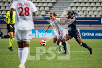 2022-05-29 - Amandine Henry of Olympique Lyonnais and Kadidiatou Diani of Paris Saint Germain fight for the ball during the Women's French championship, D1 Arkema football match between Paris Saint-Germain and Olympique Lyonnais (Lyon) on May 29, 2022 at Jean Bouin stadium in Paris, France - FOOTBALL - WOMEN'S FRENCH CHAMP - PARIS SG V OLYMPIQUE LYONNAIS - FRENCH WOMEN DIVISION 1 - SOCCER