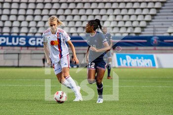 2022-05-29 - Ada Hegerberg of Olympique Lyonnais and Ashley Lawrence of Paris Saint Germain fight for the ball during the Women's French championship, D1 Arkema football match between Paris Saint-Germain and Olympique Lyonnais (Lyon) on May 29, 2022 at Jean Bouin stadium in Paris, France - FOOTBALL - WOMEN'S FRENCH CHAMP - PARIS SG V OLYMPIQUE LYONNAIS - FRENCH WOMEN DIVISION 1 - SOCCER