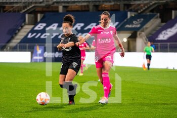 2022-10-14 - Celya Barclais of Stade de Reims and Louise Fleury of Paris FC fight for the ball during the Women's French championship D1 Arkema football match between Paris FC and Stade de Reims on October 14, 2022 at Charlety stadium in Paris, France - FOOTBALL - WOMEN'S FRENCH CHAMP - PARIS FC V STADE DE REIMS - FRENCH WOMEN DIVISION 1 - SOCCER