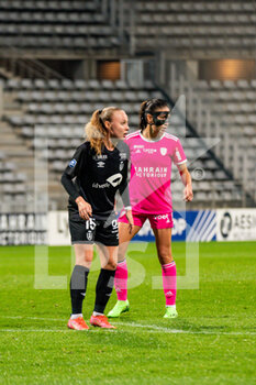 2022-10-14 - Lou Ann Joly of Stade de Reims and Clara Mateo of Paris FC during the Women's French championship D1 Arkema football match between Paris FC and Stade de Reims on October 14, 2022 at Charlety stadium in Paris, France - FOOTBALL - WOMEN'S FRENCH CHAMP - PARIS FC V STADE DE REIMS - FRENCH WOMEN DIVISION 1 - SOCCER