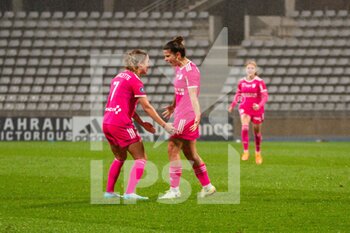 2022-10-14 - Mathilde Bourdieu of Paris FC celebrates with Tess Laplacette of Paris FC after scoring second goal during the Women's French championship D1 Arkema football match between Paris FC and Stade de Reims on October 14, 2022 at Charlety stadium in Paris, France - FOOTBALL - WOMEN'S FRENCH CHAMP - PARIS FC V STADE DE REIMS - FRENCH WOMEN DIVISION 1 - SOCCER
