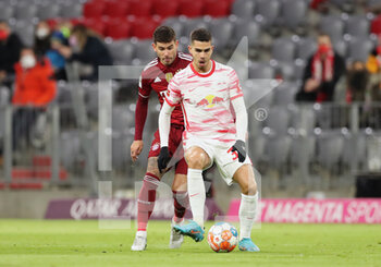 2022-02-05 - Andre Silva of RB Leipzig and Lucas Hernandez of Bayern Munich during the German championship Bundesliga football match between Bayern Munich and RB Leipzig on February 5, 2022 at Allianz Arena in Munich, Germany - BAYERN MUNICH VS RB LEIPZIG - GERMAN BUNDESLIGA - SOCCER