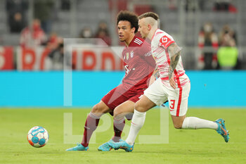 2022-02-05 - Leroy Sane of Bayern Munich and Angelino of RB Leipzig during the German championship Bundesliga football match between Bayern Munich and RB Leipzig on February 5, 2022 at Allianz Arena in Munich, Germany - BAYERN MUNICH VS RB LEIPZIG - GERMAN BUNDESLIGA - SOCCER