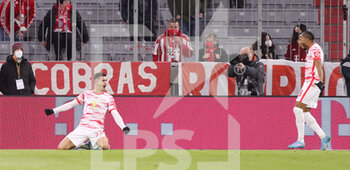 2022-02-05 - Andre Silva of RB Leipzig celebrates his goal 1-1 with Christopher Nkunku during the German championship Bundesliga football match between Bayern Munich and RB Leipzig on February 5, 2022 at Allianz Arena in Munich, Germany - BAYERN MUNICH VS RB LEIPZIG - GERMAN BUNDESLIGA - SOCCER