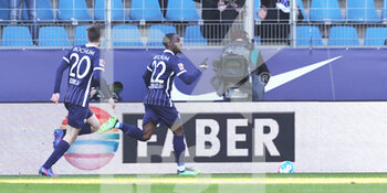 2022-02-12 - Christopher Antwi-Adjei of Bochum celebrates his goal 1-1 with Elvis Rexhbecaj during the German championship Bundesliga football match between VfL Bochum and Bayern Munich on February 12, 2022 at Vonovia Ruhrstadion in Bochum, Germany - VFL BOCHUM VS BAYERN MUNICH - GERMAN BUNDESLIGA - SOCCER