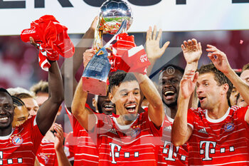 2022-07-30 - Noussair Mazraoui of Bayern Munich celebrates with the trophy during the German Super Cup football match between RB Leipzig and Bayern Munich on July 30, 2022 at Red Bull Arena in Leipzig, Germany - FOOTBALL - GERMAN SUPER CUP - RB LEIPZIG V BAYERN MUNICH - GERMAN SUPERCUP - SOCCER