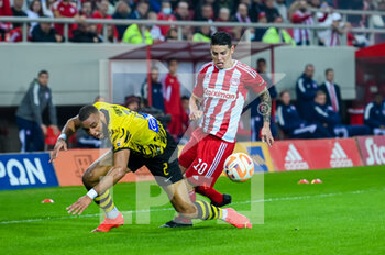 2022-11-13 - 10 JAMES RODRÍGUEZ of Olympiacos FC competing with 2 HAROLD MOUKOUDI of AEK FC during Matchday 13, Greek Super League match between Olympiacos FC vs AEK FC at the Karaiskakis Stadium on November 13, 2022 in Athens, Greece. - OLYMPIACOS FC VS AEK FC - GREEK SUPER LEAGUE - SOCCER