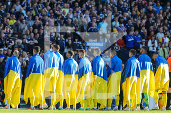 2022-06-01 - Ukraine players during the National Anthem before the FIFA World Cup 2022, Qualifiers Play-off football match between Scotland and Ukraine on June 1, 2022 at Hampden Park in Glasgow, Scotland - FOOTBALL - WORLD CUP 2022 - QUALIFIERS - PLAY OFF - SCOTLAND V UKRAINE - FIFA WORLD CUP - SOCCER