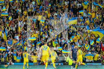 2022-06-01 - Roman Yaremchuk (L) of Ukraine celebrates after his goal 0-2 during the FIFA World Cup 2022, Qualifiers Play-off football match between Scotland and Ukraine on June 1, 2022 at Hampden Park in Glasgow, Scotland - FOOTBALL - WORLD CUP 2022 - QUALIFIERS - PLAY OFF - SCOTLAND V UKRAINE - FIFA WORLD CUP - SOCCER
