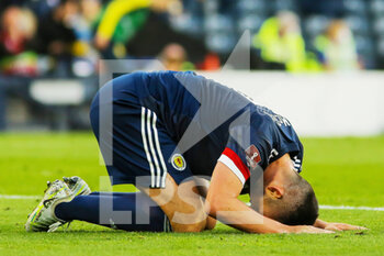 2022-06-01 - John McGinn of Scotland reacts during the FIFA World Cup 2022, Qualifiers Play-off football match between Scotland and Ukraine on June 1, 2022 at Hampden Park in Glasgow, Scotland - FOOTBALL - WORLD CUP 2022 - QUALIFIERS - PLAY OFF - SCOTLAND V UKRAINE - FIFA WORLD CUP - SOCCER