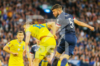 2022-06-01 - Grant Hanley of Scotland and Illya Zabarnyi of Ukraine during the FIFA World Cup 2022, Qualifiers Play-off football match between Scotland and Ukraine on June 1, 2022 at Hampden Park in Glasgow, Scotland - FOOTBALL - WORLD CUP 2022 - QUALIFIERS - PLAY OFF - SCOTLAND V UKRAINE - FIFA WORLD CUP - SOCCER