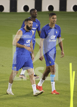 2022-11-19 - Karim Benzema, Raphael Varane, behind Ousmane Dembele of France during Team France practice ahead of the FIFA World Cup 2022 on November 19, 2022 in Doha, Qatar - FOOTBALL - WORLD CUP 2022 - PREVIEWS - 19/11 - FIFA WORLD CUP - SOCCER