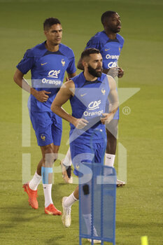 2022-11-19 - Karim Benzema, behind Raphael Varane, Ousmane Dembele of France during Team France practice ahead of the FIFA World Cup 2022 on November 19, 2022 in Doha, Qatar - FOOTBALL - WORLD CUP 2022 - PREVIEWS - 19/11 - FIFA WORLD CUP - SOCCER
