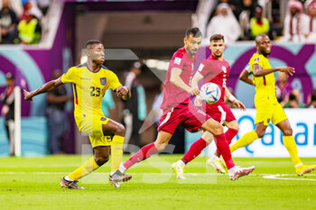 2022-11-20 - Moises Caicedo (23) of Ecuador and Boualem Khoukhi of Qatar during the FIFA World Cup 2022, Group A football match between Qatar and Ecuador on November 20, 2022 at Al Bayt Stadium in Al-Khor, Qatar - FOOTBALL - WORLD CUP 2022 - QATAR V ECUADOR - FIFA WORLD CUP - SOCCER