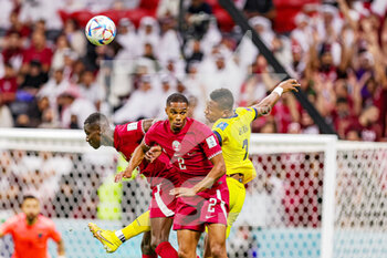 2022-11-20 - Pervis Estupinan (7) of Ecuador and Pedro Miguel of Qatar during the FIFA World Cup 2022, Group A football match between Qatar and Ecuador on November 20, 2022 at Al Bayt Stadium in Al-Khor, Qatar - FOOTBALL - WORLD CUP 2022 - QATAR V ECUADOR - FIFA WORLD CUP - SOCCER
