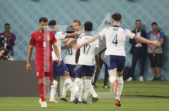 21/11/2022 - Raheem Sterling of England celebrates his goal with Harry Kane and teammates during the FIFA World Cup 2022, Group B football match between England and Iran on November 21, 2022 at Khalifa International Stadium in Doha, Qatar - FOOTBALL - WORLD CUP 2022 - ENGLAND V IRAN - FIFA MONDIALI - CALCIO