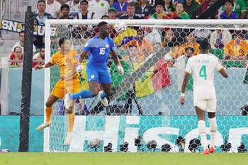2022-11-21 - Cody Gakpo of Netherlands scores a goal 0-1, Edouard Mendy of Senegal during the FIFA World Cup 2022, Group A football match between Senegal and Netherlands on November 21, 2022 at Al Thumama Stadium in Doha, Qatar - FOOTBALL - WORLD CUP 2022 - SENEGAL V NETHERLANDS - FIFA WORLD CUP - SOCCER