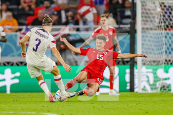 21/11/2022 - Ethan Ampadu (15) of Wales flies in tackles Walker Zimmerman (3) of United States during the FIFA World Cup 2022, Group B football match between United States and Wales on November 21, 2022 at Ahmad Bin Ali Stadium in Ar-Rayyan, Qatar - FOOTBALL - WORLD CUP 2022 - UNITED STATES V WALES - FIFA MONDIALI - CALCIO