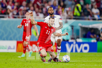 21/11/2022 - Kellyn Acosta (23) of United States of America brings down Gareth Bale (11) of Wales during the FIFA World Cup 2022, Group B football match between United States and Wales on November 21, 2022 at Ahmad Bin Ali Stadium in Ar-Rayyan, Qatar - FOOTBALL - WORLD CUP 2022 - UNITED STATES V WALES - FIFA MONDIALI - CALCIO
