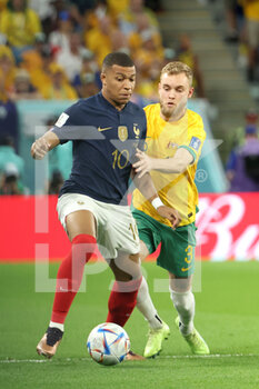 22/11/2022 - Kylian Mbappe of France, Nathaniel Atkinson of Australia during the FIFA World Cup 2022, Group D football match between France and Australia on November 22, 2022 at Al Janoub Stadium in Al Wakrah, Qatar - FOOTBALL - WORLD CUP 2022 - FRANCE V AUSTRALIA - FIFA MONDIALI - CALCIO