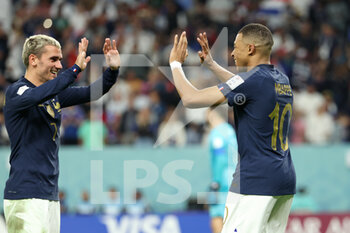 22/11/2022 - Kylian Mbappe of France celebrates with Antoine Griezmann of France (L) after putting his side 3-1 ahead during the FIFA World Cup 2022, Group D football match between France and Australia on November 22, 2022 at Al Janoub Stadium in Al Wakrah, Qatar - FOOTBALL - WORLD CUP 2022 - FRANCE V AUSTRALIA - FIFA MONDIALI - CALCIO
