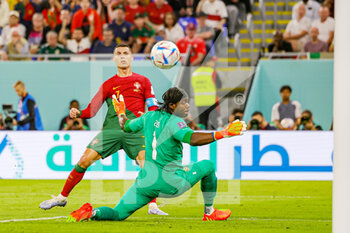 2022-11-24 - Cristiano Ronaldo (7) of Portugal scores but the goal is disallowed, Lawrence Ati-Zigi (1) of Ghana during the Fifa World Cup 2022, Group H football match between Portugal and Ghana on November 24, 2022 at Stadium 974 in Doha, Qatar - FOOTBALL - WORLD CUP 2022 - PORTUGAL V GHANA - FIFA WORLD CUP - SOCCER