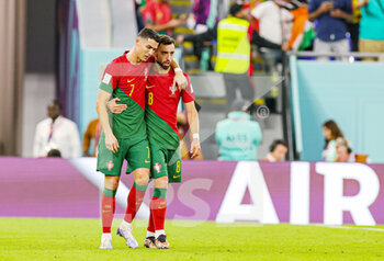 24/11/2022 - Cristiano Ronaldo (7) of Portugal scores from the penalty spot 1-0 and celebrates with ex team mate Bruno Fernandes (8) of Portugal during the Fifa World Cup 2022, Group H football match between Portugal and Ghana on November 24, 2022 at Stadium 974 in Doha, Qatar - FOOTBALL - WORLD CUP 2022 - PORTUGAL V GHANA - FIFA MONDIALI - CALCIO