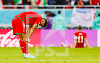 2022-11-25 - Wales players look dejected at full time during the Fifa World Cup 2022, Group B football match between Wales and Iran on November 25, 2022 at Ahmad bin Ali Stadium in Al Rayyan, Qatar - FOOTBALL - WORLD CUP 2022 - WALES V IRAN - FIFA WORLD CUP - SOCCER