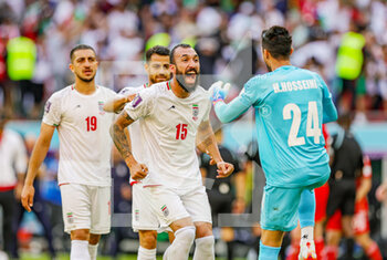 2022-11-25 - Rouzbeh Cheshmi (15) of Iran celebrates with Hossein Hosseini at full time during the Fifa World Cup 2022, Group B football match between Wales and Iran on November 25, 2022 at Ahmad bin Ali Stadium in Al Rayyan, Qatar - FOOTBALL - WORLD CUP 2022 - WALES V IRAN - FIFA WORLD CUP - SOCCER