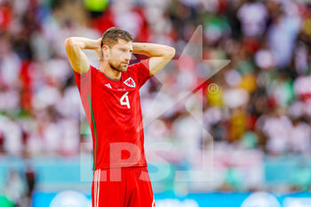 2022-11-25 - Ben Davies (4) of Wales at full time during the Fifa World Cup 2022, Group B football match between Wales and Iran on November 25, 2022 at Ahmad bin Ali Stadium in Al Rayyan, Qatar - FOOTBALL - WORLD CUP 2022 - WALES V IRAN - FIFA WORLD CUP - SOCCER