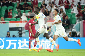 2022-11-25 - Famara Diedhiou of Senegal celebrates his goal with Abdou Diallo during the FIFA World Cup 2022, Group A football match between Qatar and Senegal on November 25, 2022 at Al Thumama Stadium in Doha, Qatar - FOOTBALL - WORLD CUP 2022 - QATAR V SENEGAL - FIFA WORLD CUP - SOCCER