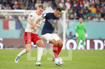 2022-11-26 - Kylian Mbappe of France, Rasmus Kristensen of Denmark (L) during the FIFA World Cup 2022, Group D football match between France and Denmark on November 26, 2022 at Stadium 974 in Doha, Qatar - FOOTBALL - WORLD CUP 2022 - FRANCE V DENMARK - FIFA WORLD CUP - SOCCER