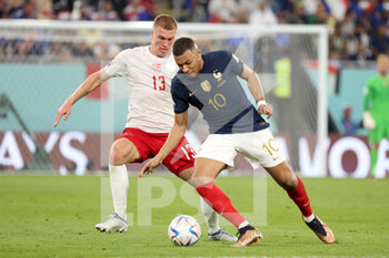 2022-11-26 - Kylian Mbappe of France, Rasmus Kristensen of Denmark (L) during the FIFA World Cup 2022, Group D football match between France and Denmark on November 26, 2022 at Stadium 974 in Doha, Qatar - FOOTBALL - WORLD CUP 2022 - FRANCE V DENMARK - FIFA WORLD CUP - SOCCER