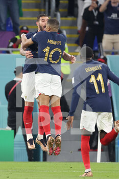 2022-11-26 - Kylian Mbappe of France celebrates with Theo Hernandez of France (L) as he scores the goal 1:0 during the FIFA World Cup 2022, Group D football match between France and Denmark on November 26, 2022 at Stadium 974 in Doha, Qatar - FOOTBALL - WORLD CUP 2022 - FRANCE V DENMARK - FIFA WORLD CUP - SOCCER