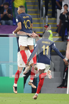 2022-11-26 - Kylian Mbappe of France celebrates with Theo Hernandez of France as he scores the goal 1:0 during the FIFA World Cup 2022, Group D football match between France and Denmark on November 26, 2022 at Stadium 974 in Doha, Qatar - FOOTBALL - WORLD CUP 2022 - FRANCE V DENMARK - FIFA WORLD CUP - SOCCER