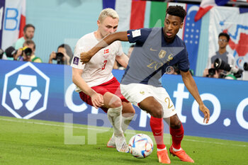 2022-11-26 - Kingsley Coman of France, Victor Nelsson of Denmark (L) during the FIFA World Cup 2022, Group D football match between France and Denmark on November 26, 2022 at Stadium 974 in Doha, Qatar - FOOTBALL - WORLD CUP 2022 - FRANCE V DENMARK - FIFA WORLD CUP - SOCCER