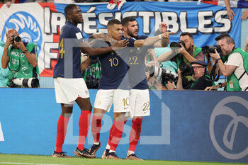 2022-11-26 - Kylian Mbappe of France celebrates with his team mates Ibrahima Konate of France, Theo Hernandez of France after scoring his team's second goal during the FIFA World Cup 2022, Group D football match between France and Denmark on November 26, 2022 at Stadium 974 in Doha, Qatar - FOOTBALL - WORLD CUP 2022 - FRANCE V DENMARK - FIFA WORLD CUP - SOCCER